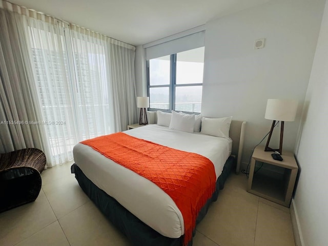 bedroom with light tile flooring