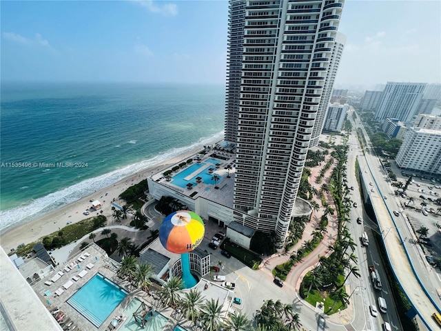 aerial view featuring a view of the beach and a water view