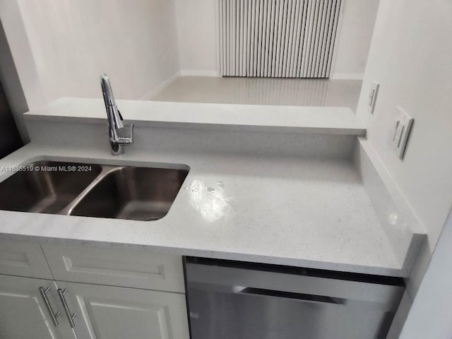 interior details featuring sink and stainless steel dishwasher