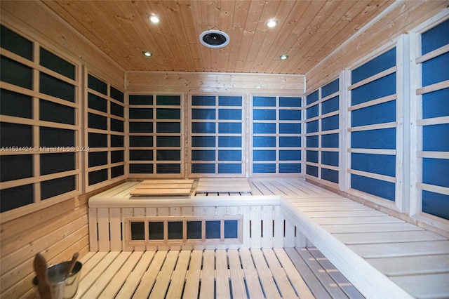 view of sauna featuring hardwood / wood-style floors and wooden ceiling