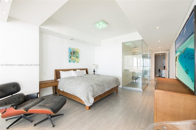 bedroom with light wood-type flooring