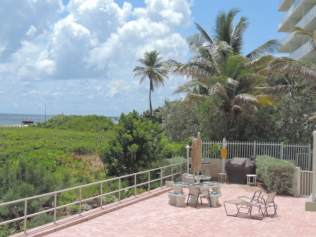 view of terrace with a water view