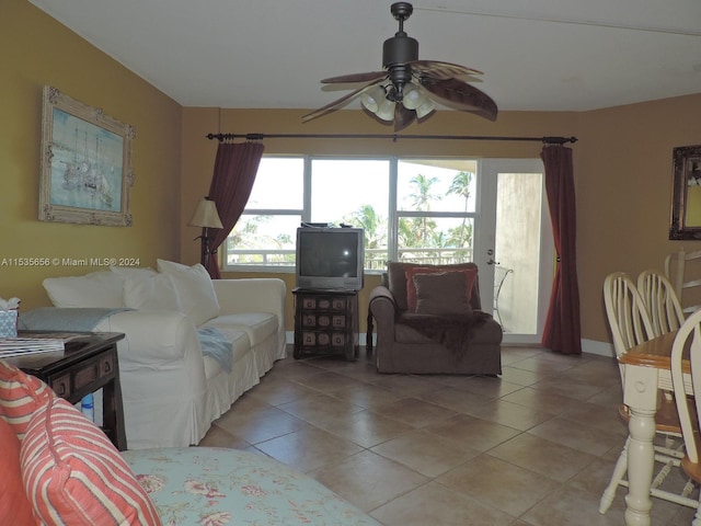 tiled living room with ceiling fan