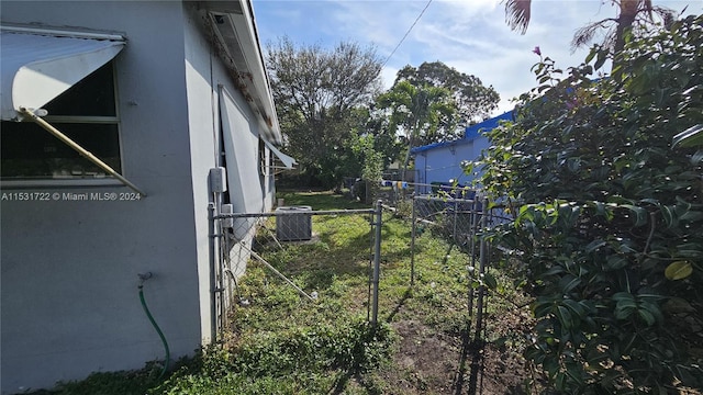 view of yard with central AC