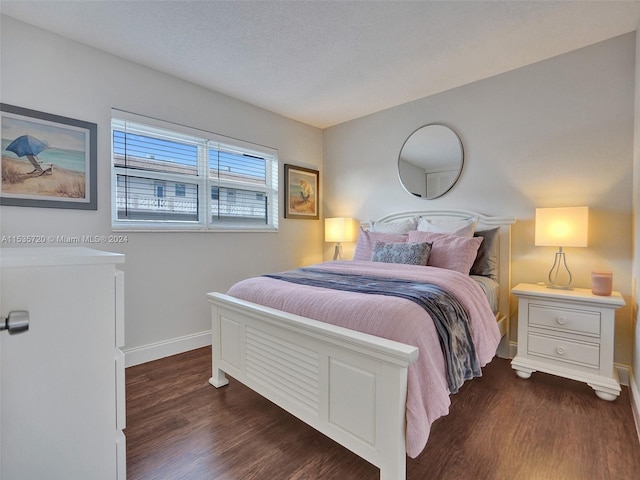 bedroom featuring dark wood-type flooring