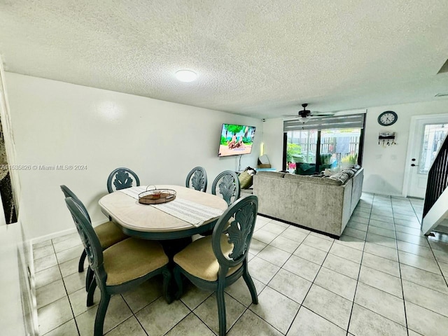 dining space featuring plenty of natural light and light tile floors