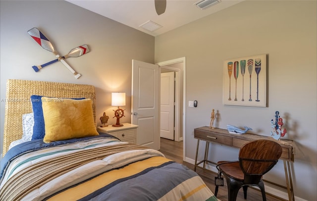 bedroom featuring ceiling fan and dark wood-type flooring