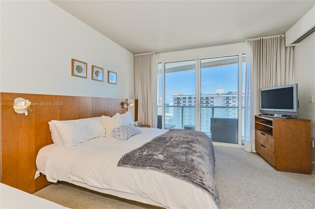 bedroom featuring access to exterior and light colored carpet