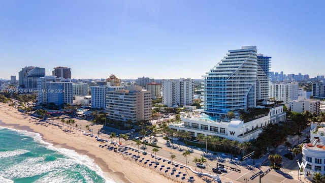 bird's eye view with a water view and a view of the beach