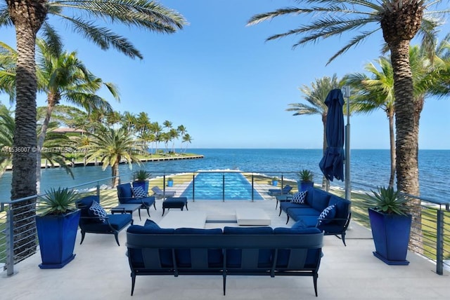 view of patio with outdoor lounge area and a water view