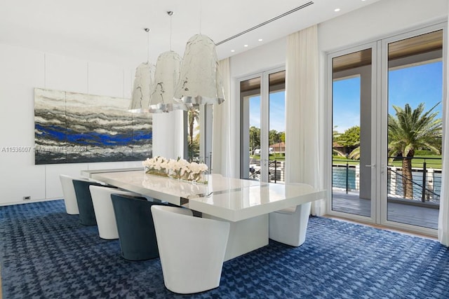 unfurnished dining area with dark colored carpet