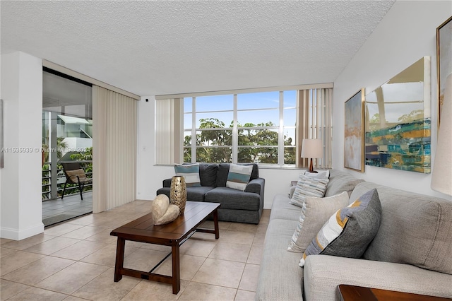 tiled living room with a textured ceiling and a wall of windows