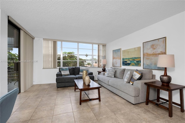 tiled living room with a textured ceiling