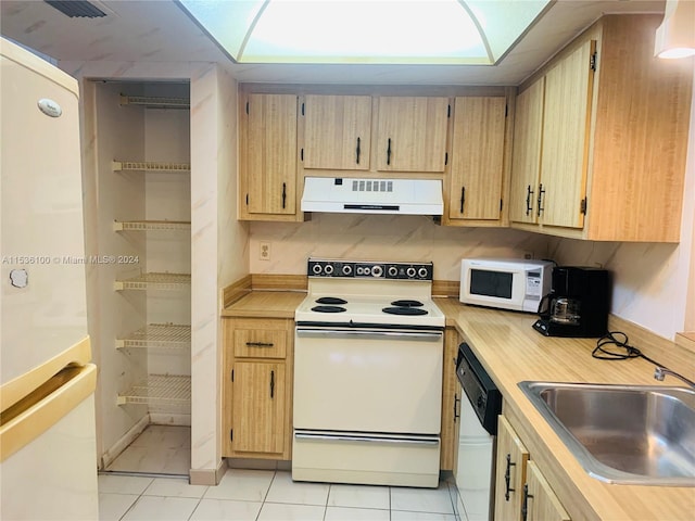 kitchen featuring backsplash, white appliances, light tile flooring, and sink