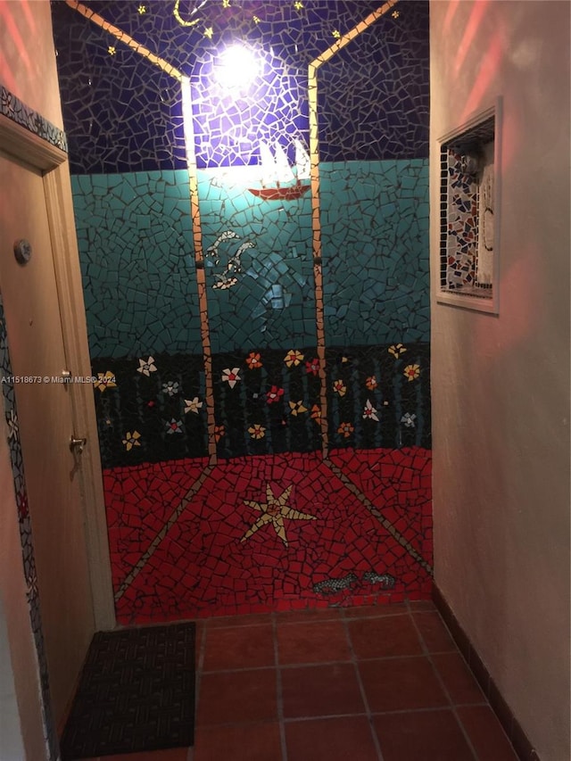 wine cellar featuring dark tile floors