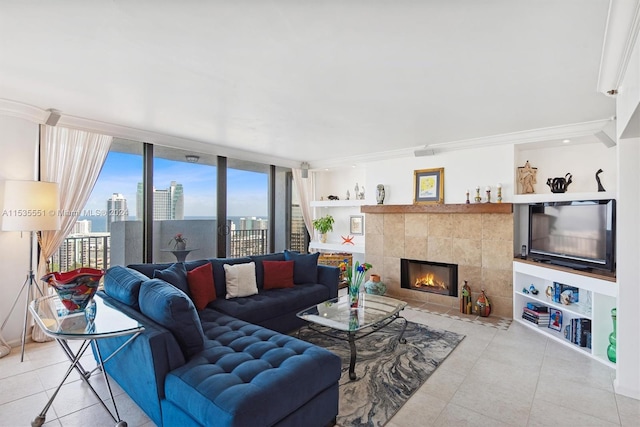 tiled living room with expansive windows, crown molding, and a fireplace