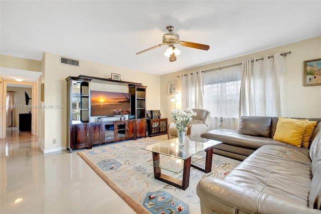 tiled living room with ceiling fan