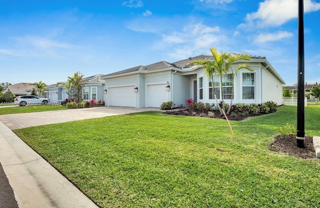 single story home with a front lawn and a garage