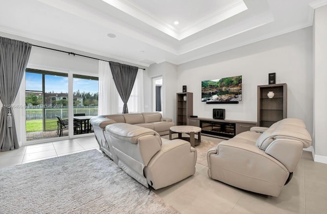 tiled living room with a tray ceiling and crown molding