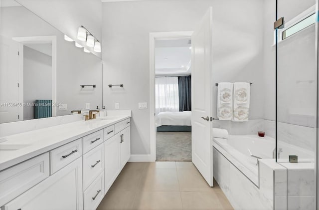 bathroom featuring dual vanity, tile floors, and tiled bath