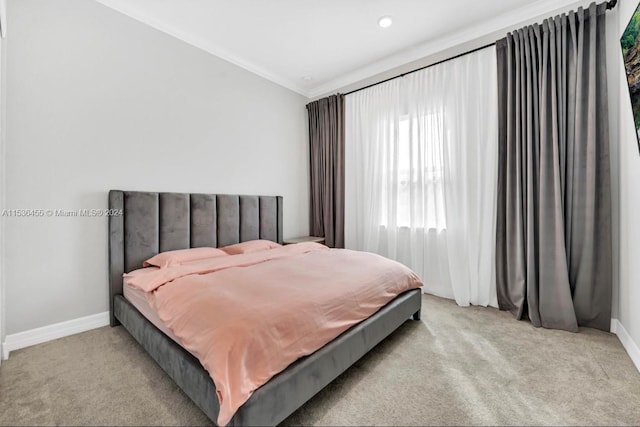 carpeted bedroom with ornamental molding