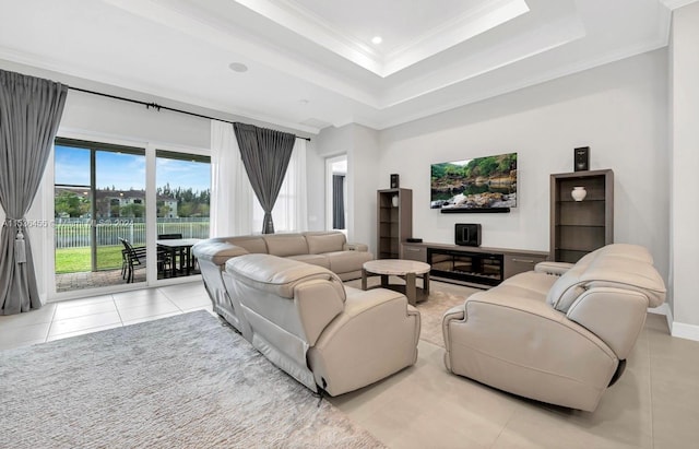 living room with a raised ceiling, light tile flooring, and ornamental molding