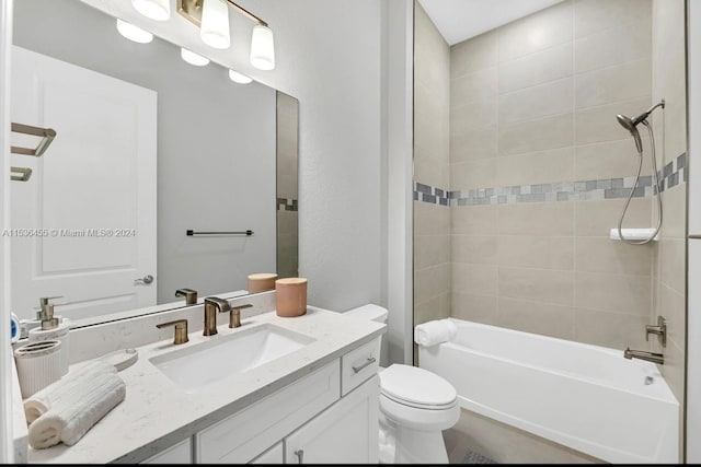 full bathroom with vanity, toilet, and tiled shower / bath