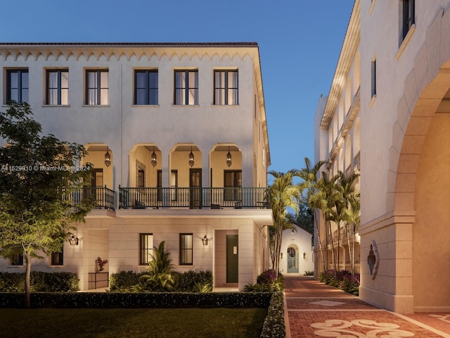 view of front of house with a balcony