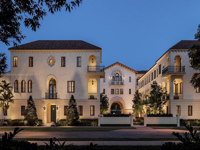 mediterranean / spanish home featuring a balcony