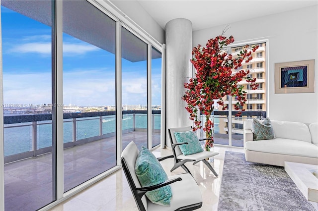 interior space featuring tile floors and a water view