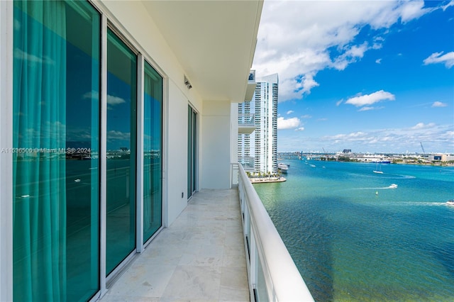 balcony featuring a water view