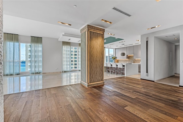 spare room featuring wood-type flooring