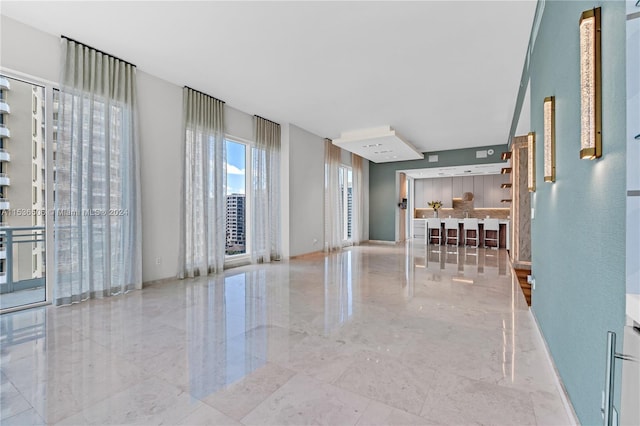 interior space featuring light tile floors