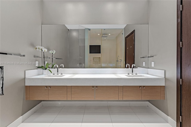 bathroom featuring tile flooring and dual vanity