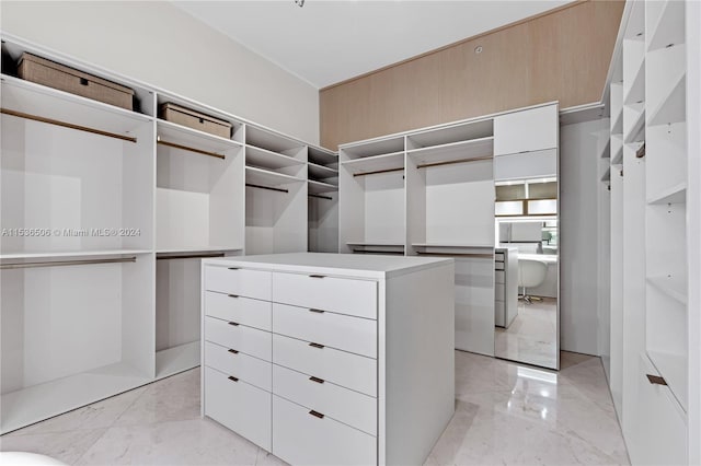 spacious closet featuring light tile floors