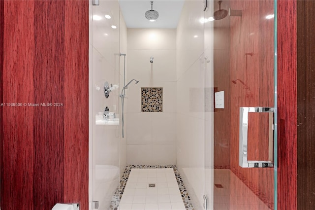 bathroom with an enclosed shower and toilet