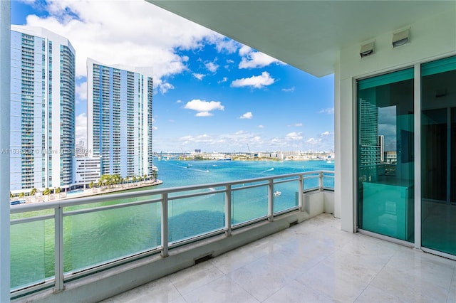 balcony featuring a water view