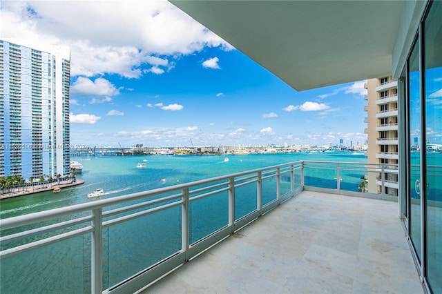 balcony featuring a water view