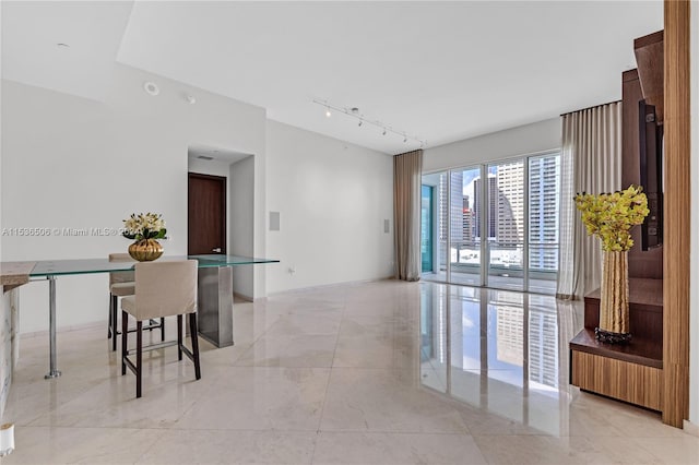 tiled dining room with track lighting