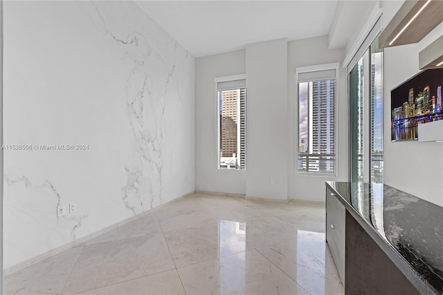 empty room with light tile flooring