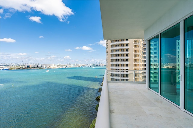 balcony featuring a water view