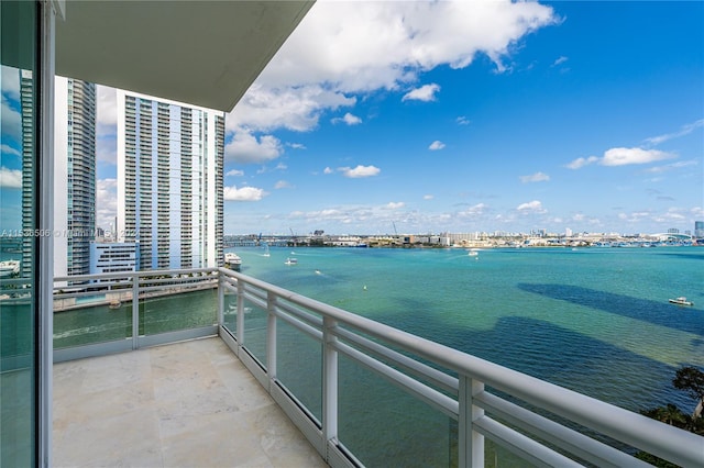 balcony featuring a water view