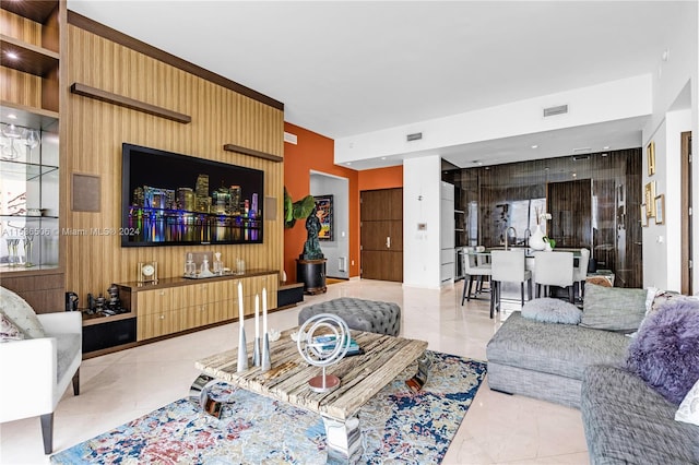 tiled living room featuring sink