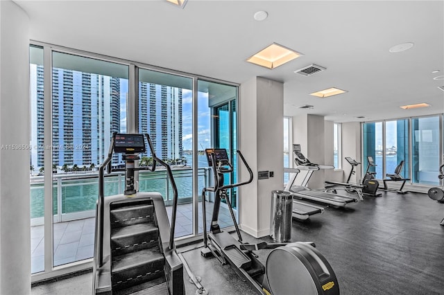 exercise room with floor to ceiling windows