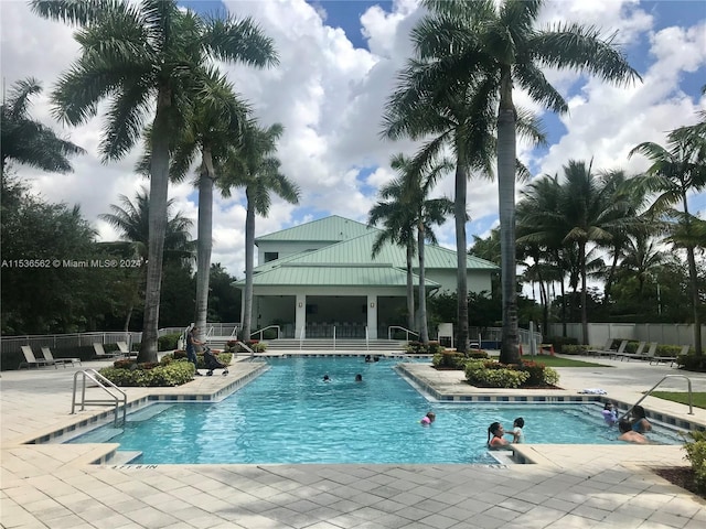 view of swimming pool with a patio