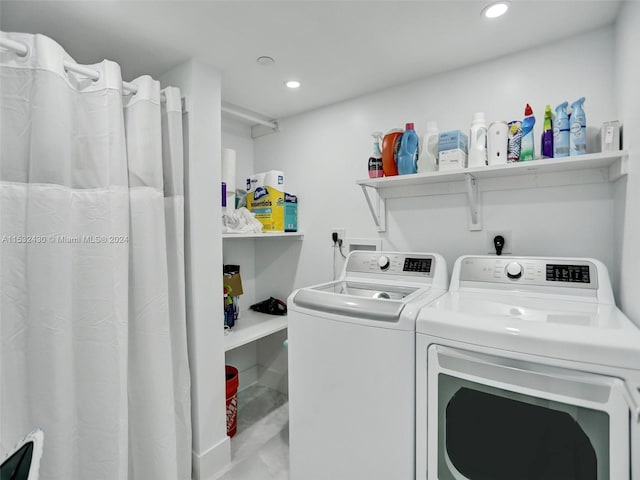 clothes washing area featuring separate washer and dryer