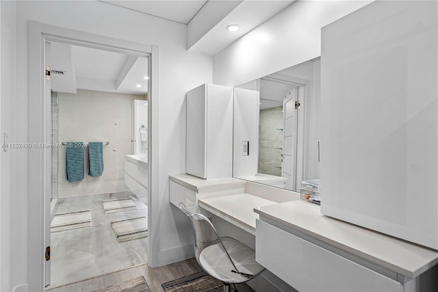 bathroom featuring hardwood / wood-style flooring and vanity