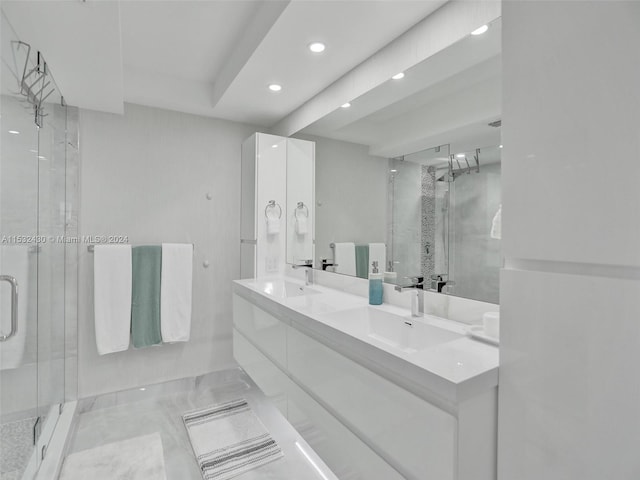 bathroom with vanity and an enclosed shower