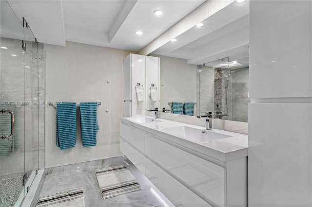 bathroom with vanity and an enclosed shower