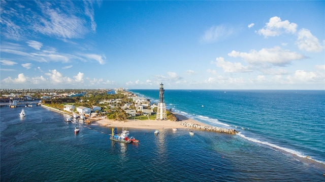 aerial view with a water view and a view of the beach